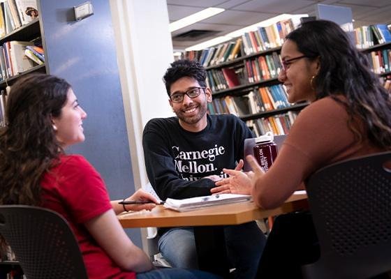 Three students in the CMU library